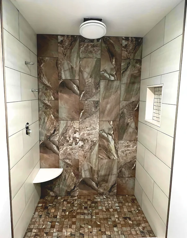 Modern shower with golden on floors and one wall