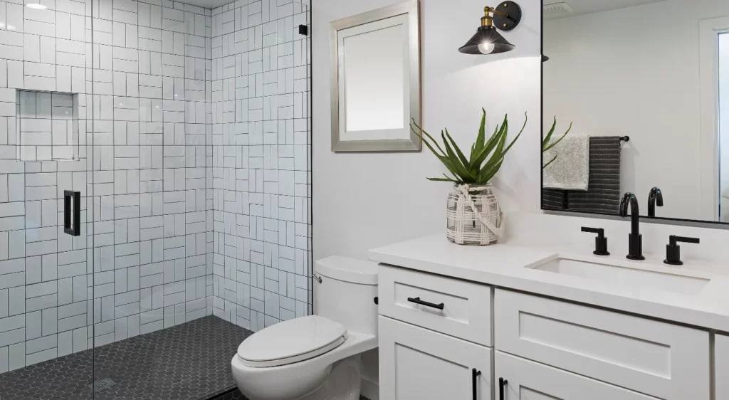 Modern boathroom with tile and white cabinets